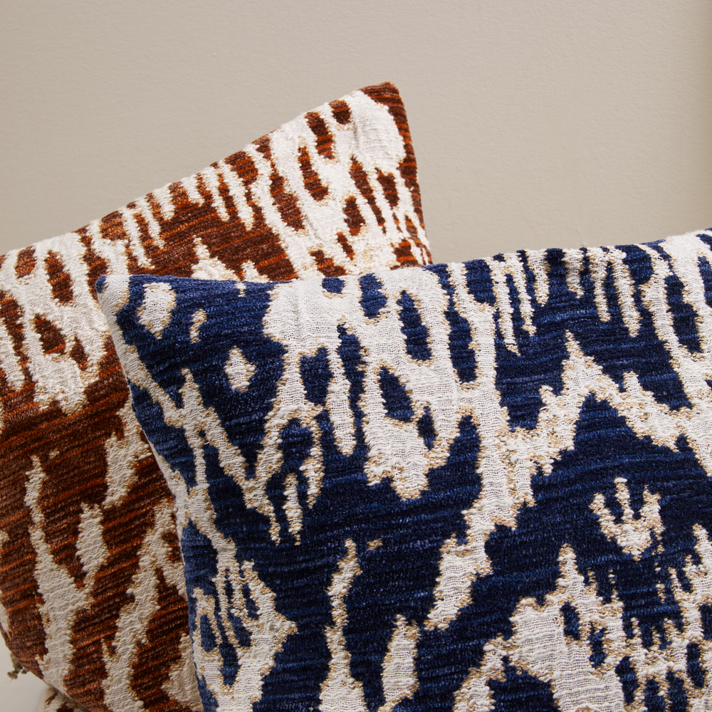 Close up image of two contrasting coloured cushions
